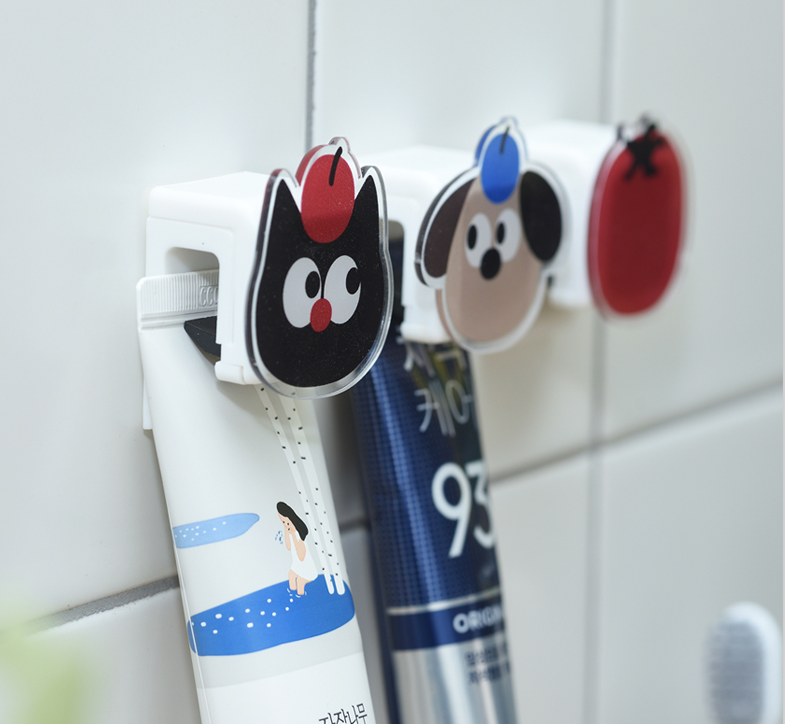 Character attachable non-perforated toothpaste rack