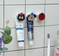 Character attachable non-perforated toothpaste rack